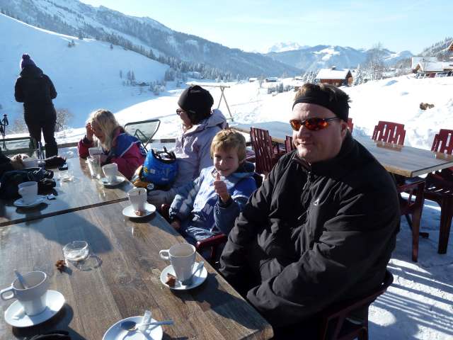 Alexander Whaley stopping with kids to enjoy a cup of Hot Chocolate on the ski slopes in Confins, France, close to the Motn Blanc.