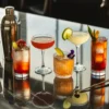 Professional mocktails displayed in various glassware showcasing colorful ingredients, fresh garnishes, and proper presentation techniques for non-alcoholic cocktail making