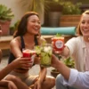 Young hip party enjoying the latest summer drinks trend