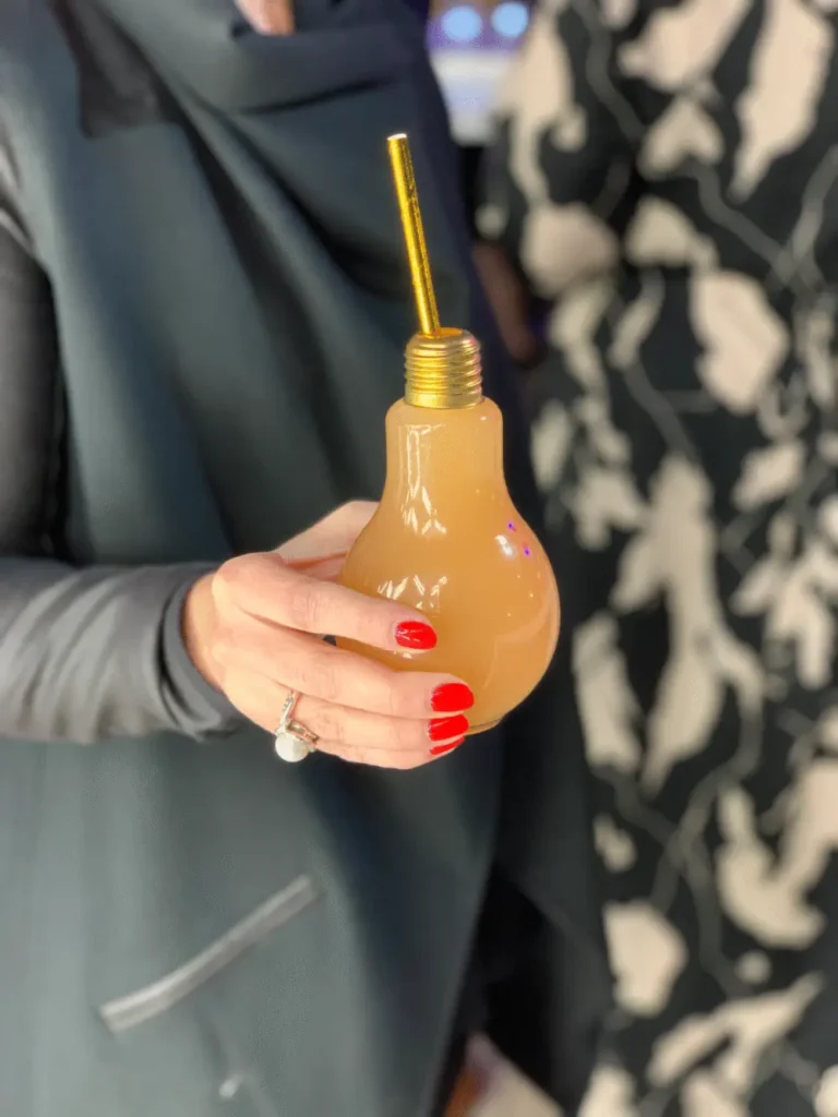 Woman holding a colourful mocktail