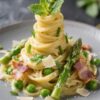 Final dish presentation: Restaurant-quality plate of Spring Vegetable Carbonara with a single, tall