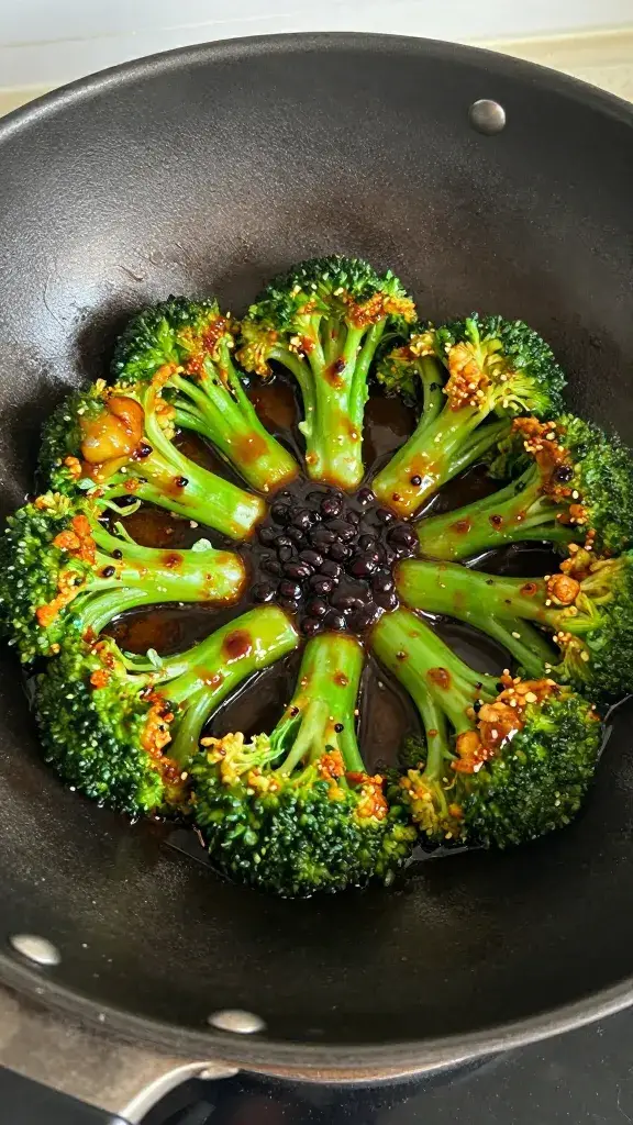 single wok-seared broccoli crown glazed in black bean sauce