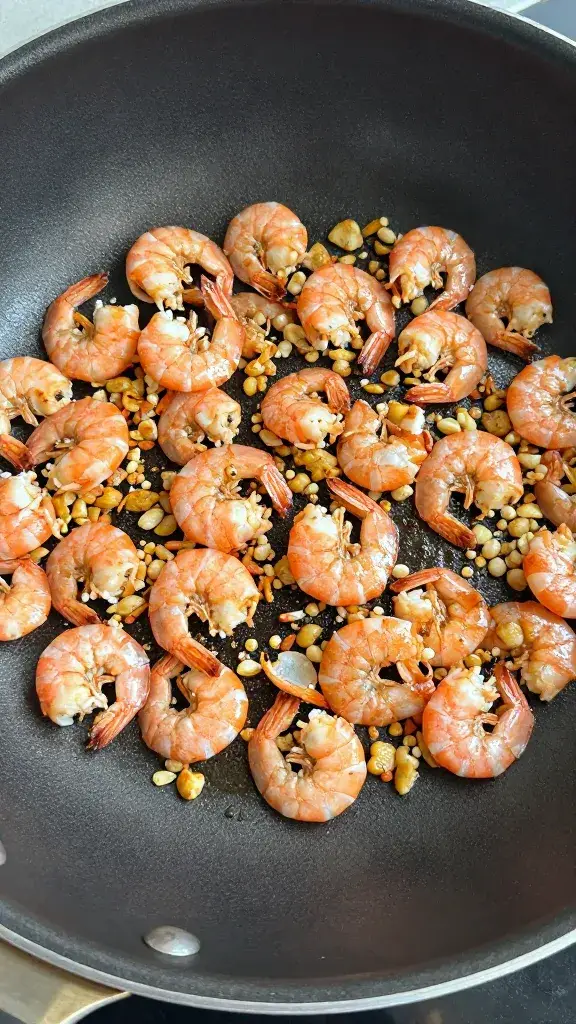 skillet toasting minced dried shrimp with aromatics