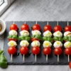 Viral Caprese Skewers (Tomato Mozzarella Basil) with Packing Tips Recipe for a Crowd: Ingredient Amounts, Prep Timeline + Serving Plan