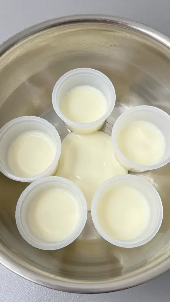 Large metal mixing bowl with 6 cups dressing marked