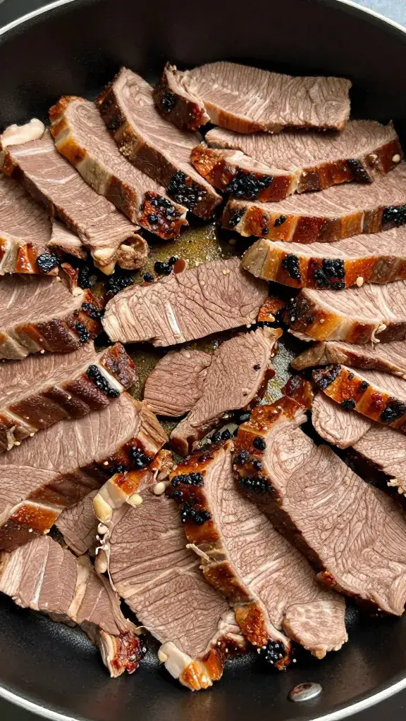 Buffet pan filled with fanned tri-tip slices