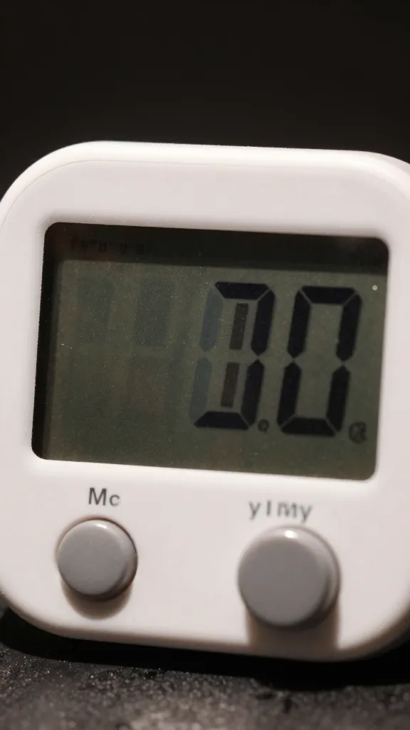 closeup of digital timer set for yakitori turns