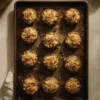 Tray of golden-topped stuffed mushroom caps