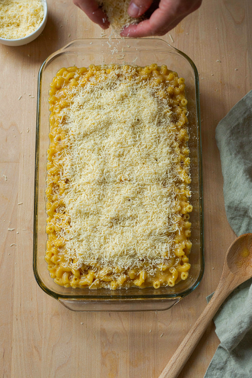 Layering macaroni and cheese in baking dish