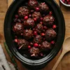 Slow cooker of glossy glazed turkey meatballs